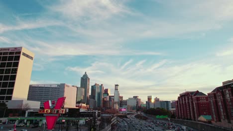 The-Varsity-against-Atlanta-Skyline-at-Sunset:-Iconic-Fast-Food-Landmark-and-Urban-Dining-Experience