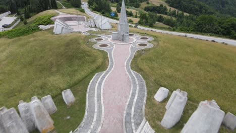 Drone-Aerial-View-of-Kadinjaca-WWII-Memorial-Complex,-Green-Landscape-of-Serbia-and-Monuments