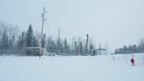 A-Northern-Remote-Industrial-Electricity-Services-Fenced-Outpost-Buried-in-Winter-Snow