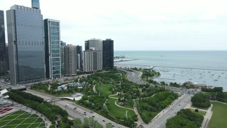 Chicago-USA,-Drone-Aerial-View-of-Millennium-Park,-Skyscrapers-and-Lake-Michigan-on-Twilight