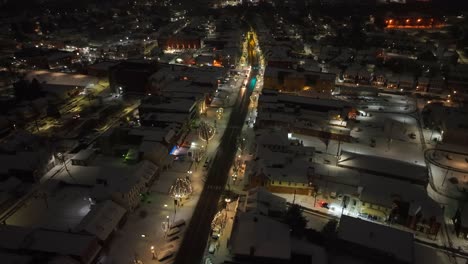 Small-town-USA-with-snow-and-Christmas-lights-at-dawn
