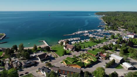 Drone-shot-flying-over-the-harbor-in-sister-bay,-Wisconsin-on-summer-day