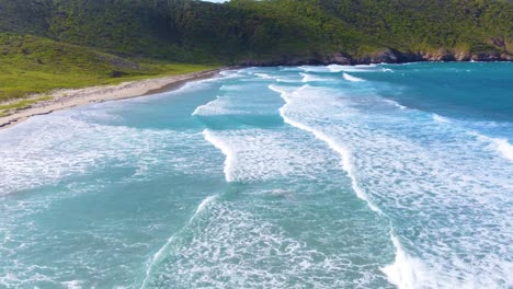 Foamy-Waves-Crawling-Over-The-Caribbean-Coast-At-Tayrona-National-Park,-Northern-Colombia