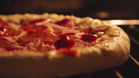 Timelapse-close-up-of-pizza-baking,-rising-in-oven,-cheese-melting,-dough-hardening,-becoming-brown