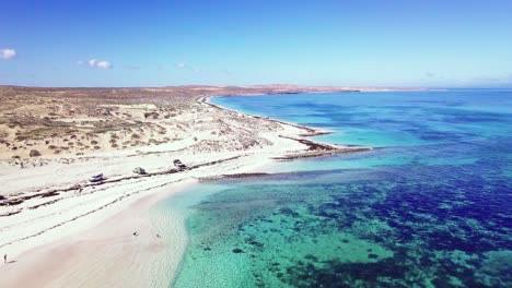 Aerial-pull-away-shot-of-a-sunny-day-in-coral-bay-in-Western-Australia