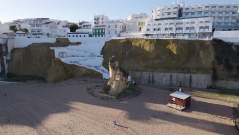 Orbiting-shot-of-Peneco-Rock-formation-at-Peneco-beach-in-Albufeira-Coastline,-Algarve