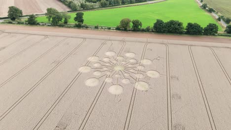 Rotating-aerial-view-above-crop-circle-on-farm-land-in-Andover,-England