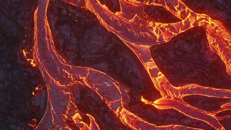 A-4K-drone-captures-cinematic,-one-of-a-kind-close-up-shots-of-cascading-lava,-resembling-abstract-tree-roots,-from-an-aerial-perspective