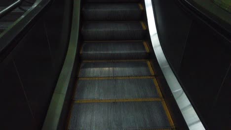 Static-shot-of-a-vintage-electric-staircase-going-up,-close-up-shot-silver-stair