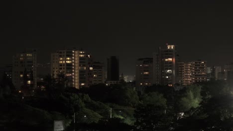 Aerial-View-of-Residential-Condo-Buildings-at-Night-in-Downtown-Neighborhood-of-Santo-Domingo,-Dominican-Republic