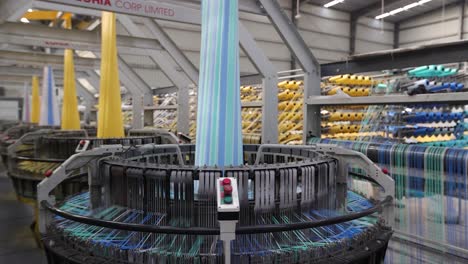 pov-shot-The-fastest-big-bag-is-being-made-in-a-big-plastic-bag-manufacturing-machine,-Lay-flat-sheet-or-a-tubular-roll-of-PE-or-PP-material,-Automatic-Soft-Loop-Handle-Bag-Making-Machine