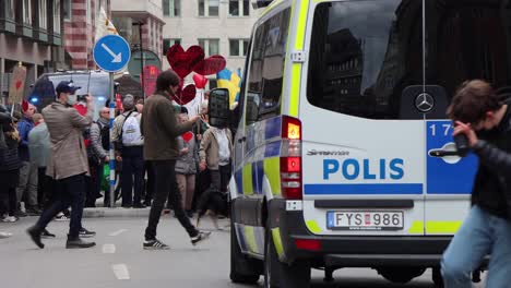 Police-van-drives-toward-protesters-in-Corona-demonstration,-Stockholm