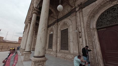 Walking-along-a-side-wall-of-Citadel-of-Saladin-with-numerous-tourists-taking-pictures