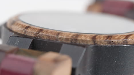 Close-up-of-a-rotating-watch-made-from-wood