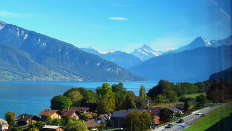 Switzerland-railway-train-bahnhof-travel-Swiss-Alps-Thunersee-lake-blue-sky-stunning-morning-Bern-Thun-Interlaken-Thunersee-Zurich-to-Saas-Fee-Seestrasse-summer-autumn-fall-Jungfrau-mountain-landscape