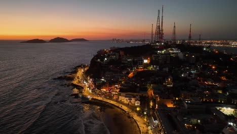 Aerial-view-overlooking-the-Malecon-and-the-Icebox-hill,-dusk-in-Mazatlan,-Mexico