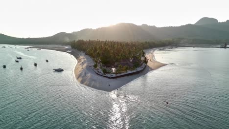 Pull-out-drone-shot-of-sunset-Siwalai-beach-on-Koh-Mook-tropical-island-in-Andaman-sea-in-Trang,-southern-Thailand