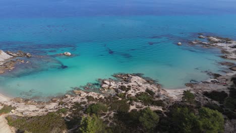 Aerial-view-along-the-famous-Kavourotripes-beach-in-Sithonia,-Chalkidiki,-Greece