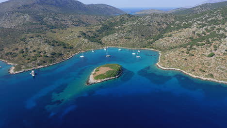 Aerial-view-of-the-bay-on-the-southwest-coast-of-the-Greek-island-of-Kira-Panagia-in-Northern-Sporades,-Greece