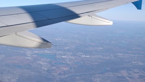 Passenger-View-From-Flying-Airplane-Window-Trailing-Edge-of-Wing