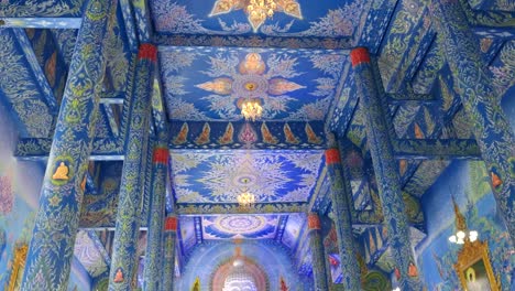Tourists-visiting-famous-blue-temple,-interior-view