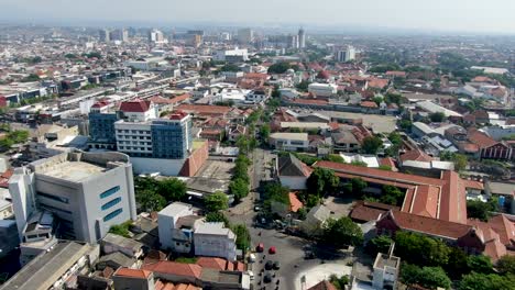 City-buildings-of-Semarang-in-Indonesia,-aerial-drone-flying-view
