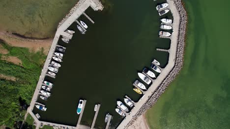 Drone-aerial-view-looking-straight-down-at-a-marina-full-of-boats-in-lake-Michigan