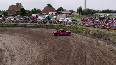 Aerial-view-of-old-cars-racing-on-dirt-track,-Friesland,-Netherlands