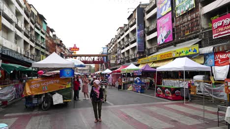 Few-people-browsing-local-market-early-in-the-morning