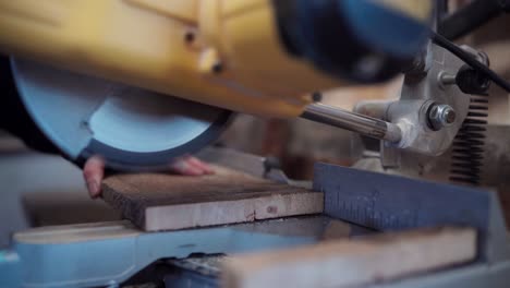 The-Man-is-Utilizing-a-Circular-Saw-to-Trim-the-Wooden-Planks-for-the-Framework-Support-of-the-DIY-Hot-Tub---Close-Up