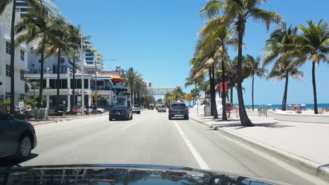 Driving-on-Boulevard-by-Fort-Lauderdale-Beach,-Florida-USA