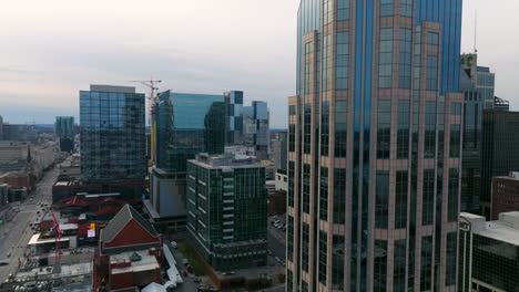 AT-and-T-Building-Overlooking-Bridgestone-Arena-And-Walk-of-Fame-Park-In-Nashville,-Tennessee