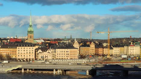 Timelapse-of-traffic-and-clouds-by-Old-Town-in-Stockholm,-Sweden