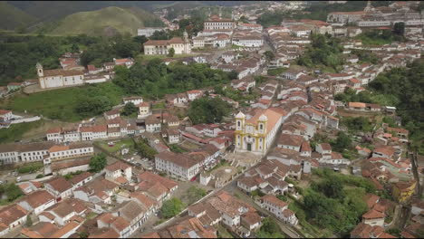 A-charming-view-of-Ouro-Preto,-a-colonial-town,-nestled-amidst-verdant-mountains,-recognized-as-a-UNESCO-World-Heritage-Site-in-Minas-Gerais,-Brazil
