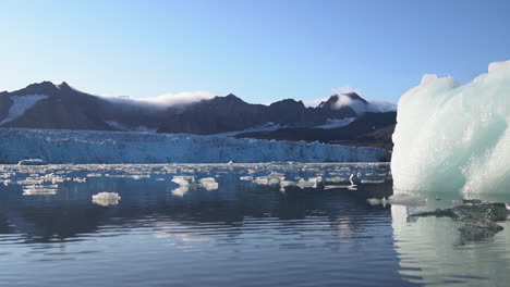 Time-Lapse,-Glacier-Lagoon-and-Flowing-Pieces-of-Ice-Under-Glacier,-14th-of-July,-Svalbard,-Norway