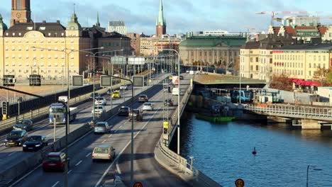 Traffic-on-bridge-in-central-Stockholm-in-evening-sunlight,-static