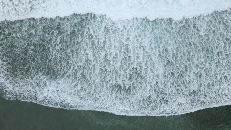 Top-down-view-of-waves-of-turquoise-sea-water