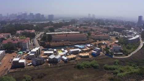 Wide-aerial-panning-shot-of-a-modular-housing-construction-site-in-West-Los-Angeles,-California