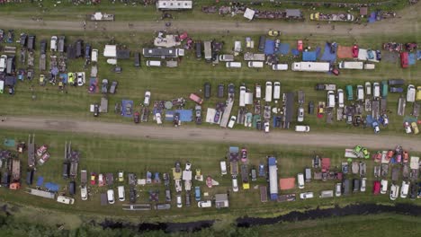 Aerial-view-of-old-cars-racing-on-dirt-track,-Friesland,-Netherlands