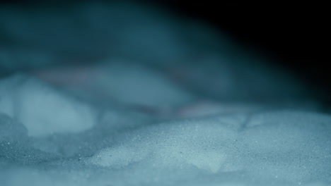 Cinematic-Close-up-of-a-snow-during-a-cold-winter-night-in-slow-motion-shot-in-4K