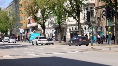 Street-traffic-on-sunny-summer-day-on-Sveavagen-in-Stockholm,-Sweden