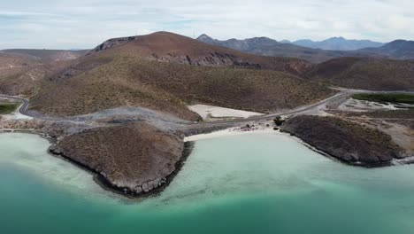 Playa-Balandra-white-beach-and-panoramic-road-along-beautiful-coast-of-Baja-California,-Mexico-in-La-Paz