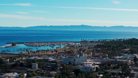 Drone-aerial-view-of-Santa-Barbara-harbor-full-of-boats-on-a-sunny-day