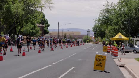 Slow-motion-shot-of-runners-down-the-road-at-the-Intermountain-Health-IRONMAN-70
