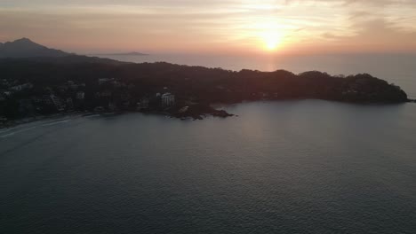 Aerial-Sunset-Landscape-of-Sayulita-Beach-Mexican-Travel-Destination-at-sunset