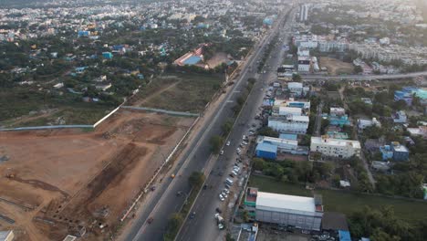 Aerial-Drone-Shot-of-Highway-filled-with-cars-passing-through