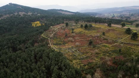 Drone-descends-to-rock-wall-pathway-of-Castro-de-San-Cibran-in-Las-Ourense-Spain