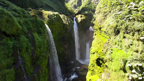 View-amazing-Quebrada-Gata-waterfall-pourings-tons-of-water-into-rocks-in-Alajuela-Province,-Costa-Rica