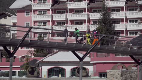 People-walking-across-a-footbridge-on-a-sunny-but-cold-winter's-day-in-St