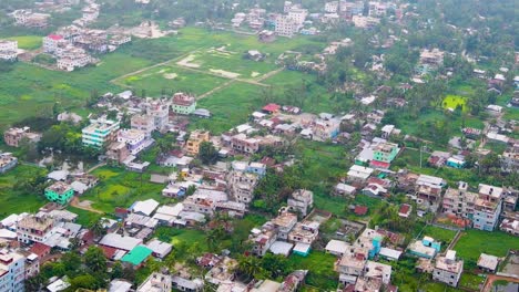 Aerial-urban-city-colorful-buildings-and-real-estate-green-space-in-Bangladesh,-Barishal